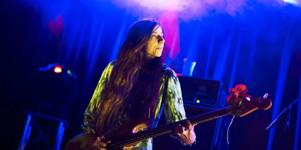 Paz Lenchantin bassist and backing vocalist of Pixies band with her bass in concert